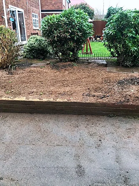 Cleared garden bed ready for landscaping after garden clearance