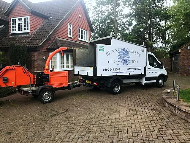 Branch Walkers Tree Surgery: Branch Walkers Tree Surgery van and wood chipper trailer on site near Uxbridge